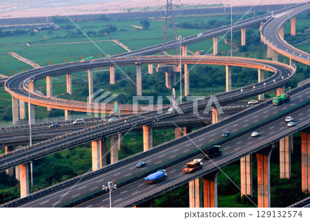 Zhongqing Interchange traffic at dusk in Taichung, Taiwan. 129132574