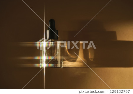 Natural facial oil with beautiful highlights on a beige background. 129132797