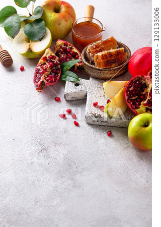 Rosh Hashana concept with honey, apple and pomegranate Rosh Hashana concept with honey, apple and pomegranate 129133006