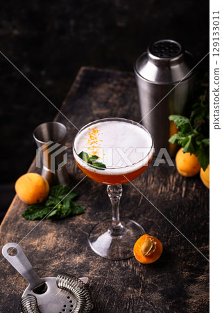 Fresh apricot cocktail martini with mint 129133011