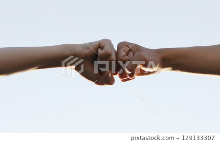 social distance. teamwork. fist to fist commit a respect and brotherhood gesture. business team hands fists. partnership friendship teamwork solidarity social distance 129133307