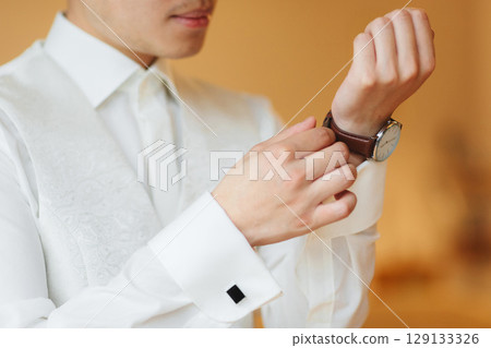 businessman clock clothes, businessman checking time on his wrist watch. mens hand with a watch, watch on a man's hand, putting the clock on the hand, fasten clock watch time, man's style 129133326