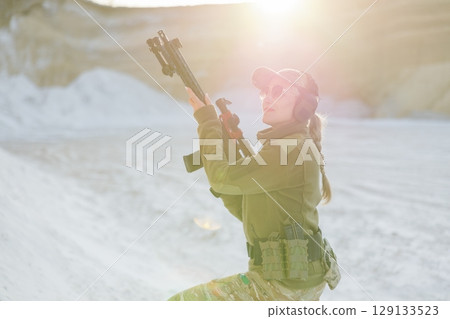 Soldier reloading rifle during winter military training exercise Soldier reloading rifle during winter military training exercise 129133523