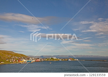 Honningsvag harbour panorama with fishing boats and arctic landscape Honningsvag harbour panorama with fishing boats and arctic landscape 129133559