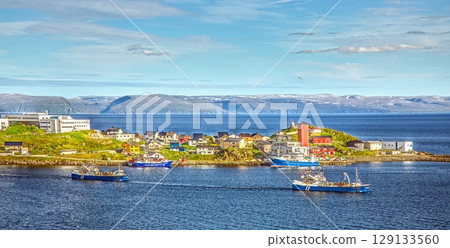 Coastal town Honningsvag Nordkapp with colourful houses and blue sea Coastal town Honningsvag Nordkapp with colourful houses and blue sea 129133560