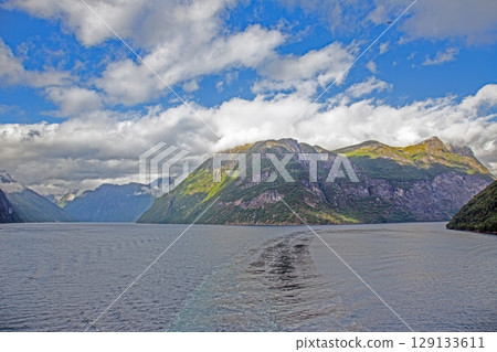 geirangerfjord wide fjord valley vista under cloudy sky geirangerfjord wide fjord valley vista under cloudy sky 129133611