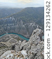 aerial view of Sulak River winding through dramatic canyon walls from Dubki observation platform, Dagestan, Russia 129134262
