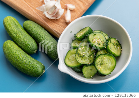 Fresh cucumber salad with dill and sesame seeds 129135366