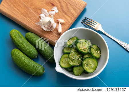 Fresh cucumber salad with dill and sesame seeds 129135367