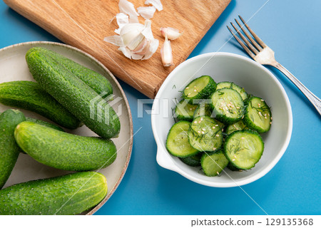 Fresh cucumber salad with dill and sesame seeds 129135368