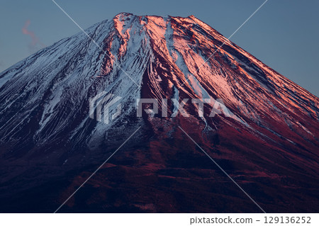 The summit of Mt. Fuji in the evening sun seen from the panoramic platform The summit of Mt. Fuji in the evening sun seen from the panoramic platform 129136252