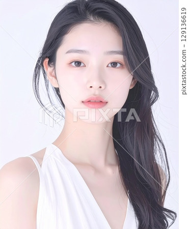 A close-up portrait of a young Japanese woman with beautiful white skin, bathed in soft light 129136619