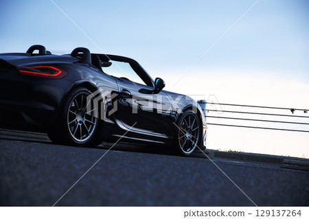 Glossy black open car Glossy black open car 129137264