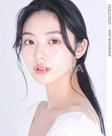 A close-up of a Japanese woman with fair skin, carefully captured, exuding youth and cleanliness. 129137852