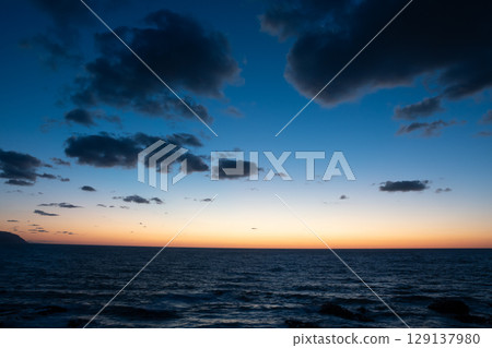 Orange horizon and Venus after sunset Orange horizon and Venus after sunset 129137980