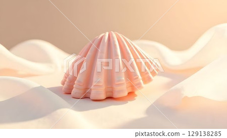 Delicate pink shell resting on soft white fabric with warm sunlight illuminating the scene 129138285