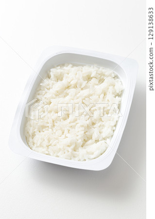 Packed rice on white background 129138633