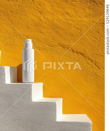 A bottle of lotion is sitting on a set of white steps 129139646