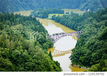 Tadami Line: The first train crossing the Tadami River Bridge in summer (Mishima Town, Fukushima Prefecture, mid-July) 129139792