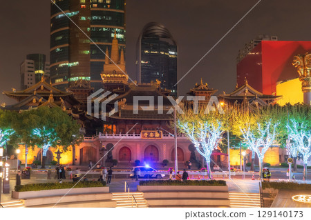 Aerial view of Jing'an temple with light up on tree at night, Shanghai 129140173