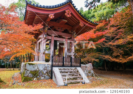 Bell tower by colorful autumn maple leaf in Daigoji temple,Kyoto 129140193