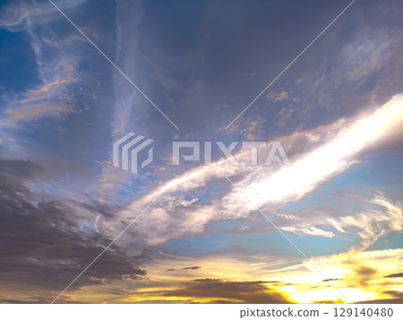 The sun seen through the gaps in the clouds 129140480