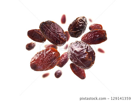Dried dates levitate on a white background 129141359