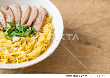 dried duck noodles in white bowl 129141430