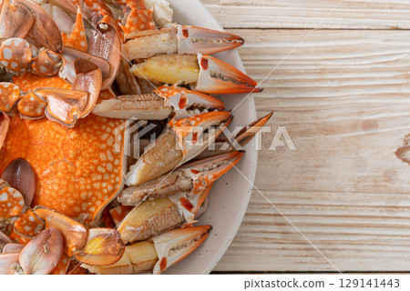 Steamed blue crab with spicy seafood sauce Steamed blue crab with spicy seafood sauce 129141443