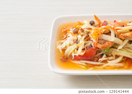 Som Tum - Spicy papaya salad Som Tum - Spicy papaya salad 129141444