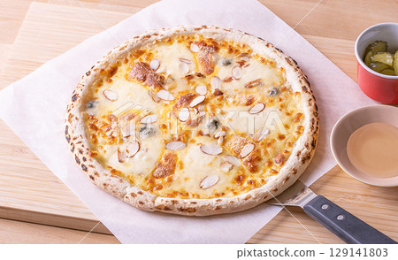 pizza on wooden background pizza on wooden background 129141803
