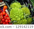 Romanesco and cherry tomatoes for sale at an Italian market 129142119