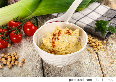 Natural chickpea hummus with paprika 129142299