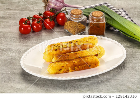 Crispy breaded mozarella cheese sticks Crispy breaded mozarella cheese sticks 129142310