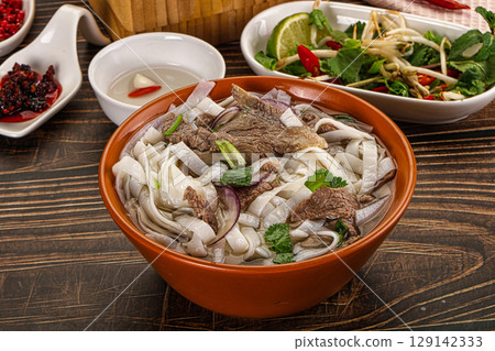 Vietnamese Pho Bo soup with beef and noodles 129142333