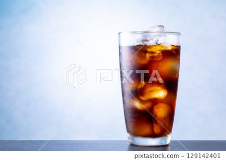 Drinking iced coffee at a cafe 129142401