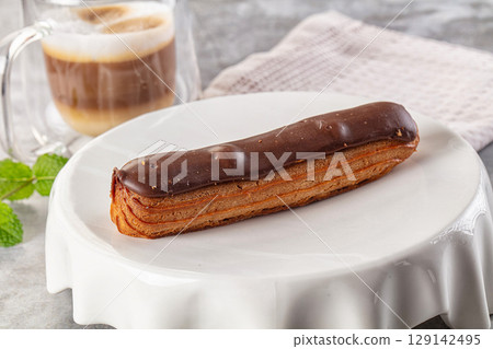 Gourmet chocolate eclair with icing Gourmet chocolate eclair with icing 129142495
