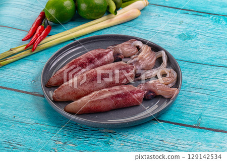 Raw fresh young baby squid Raw fresh young baby squid 129142534