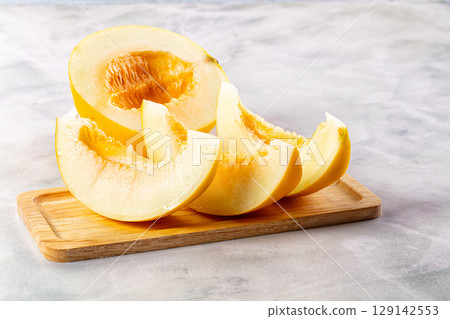 Ripe sweet juicy melon with slices 129142553