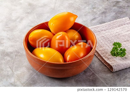 Sweet juicy ripe yellow tomato 129142570