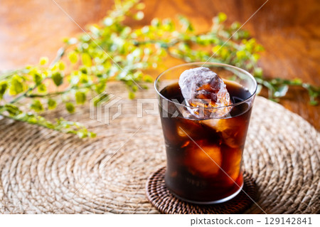 Drinking iced coffee at a cafe 129142841