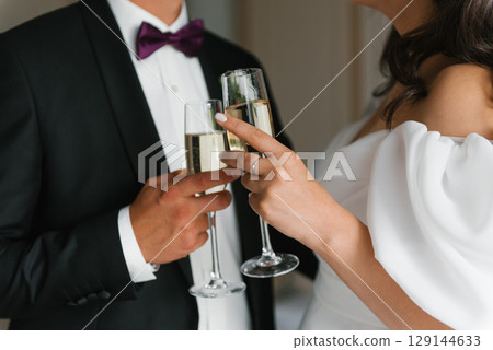 Bride And Groom Toasting Champagne Bride And Groom Toasting Champagne 129144633