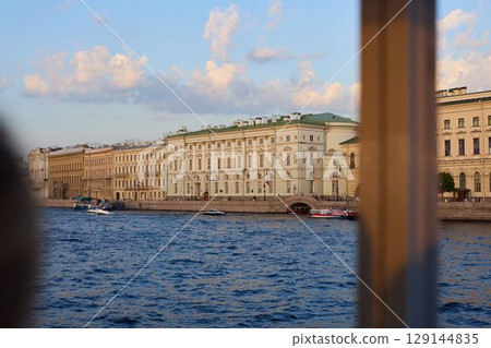 St. Petersburg offers a stunning sunset river view, showcasing its beautiful historic architecture St. Petersburg offers a stunning sunset river view, showcasing its beautiful historic architecture 129144835