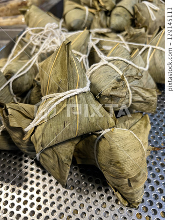 Photographing a bunch of fresh Zongzi at the Taichung Traditional Market Photographing a bunch of fresh Zongzi at the Taichung Traditional Market 129145111