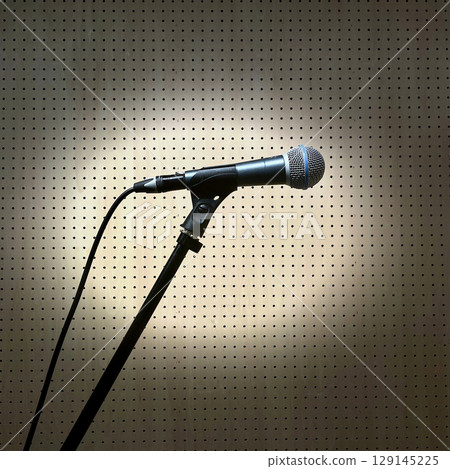 Vocal microphone set on a microphone stand 129145225