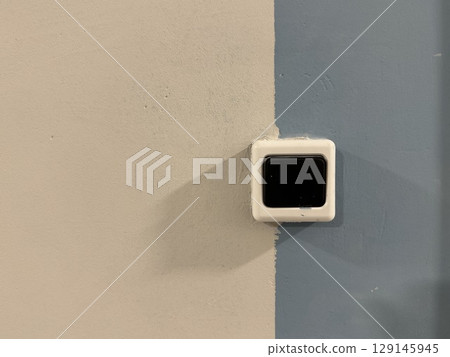 A doorbell on a beige-blue background in a new building. High quality photo A doorbell on a beige-blue background in a new building. High quality photo 129145945