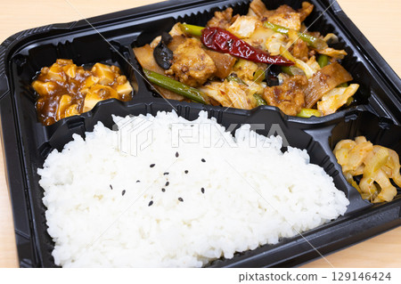 Delicious chili pepper, meat and vegetable stir-fry Chinese lunch box 129146424