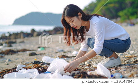 Young Japanese woman picking up trash on the beach Generative AI Young Japanese woman picking up trash on the beach Generative AI 129147045