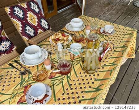 Breakfast in a Provencal-style country house in summer. High quality photo 129147235