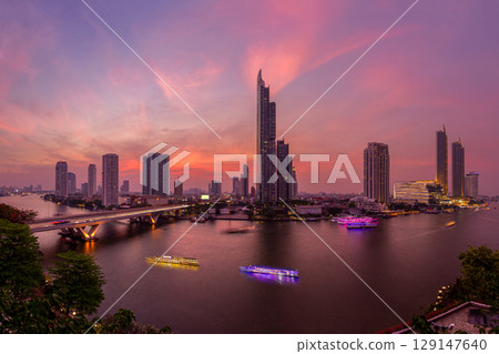 Chao Phraya River under sunset sky, twilight, view from top of Bangkok building. 129147640
